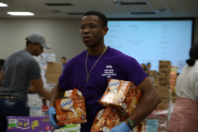 TCU student volunteering at a food pantry