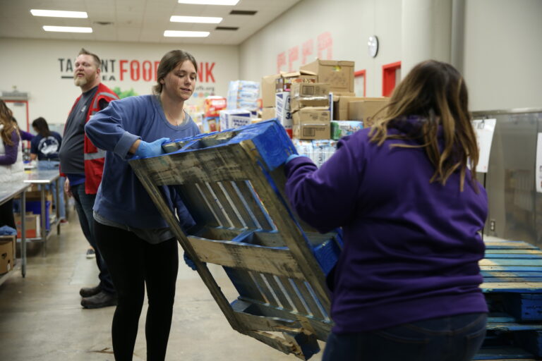 TCU students volunteering at a food pantry