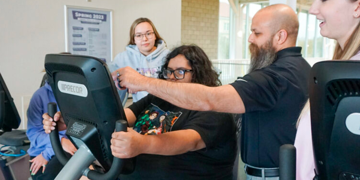 Dr. Esposito working with students and participant