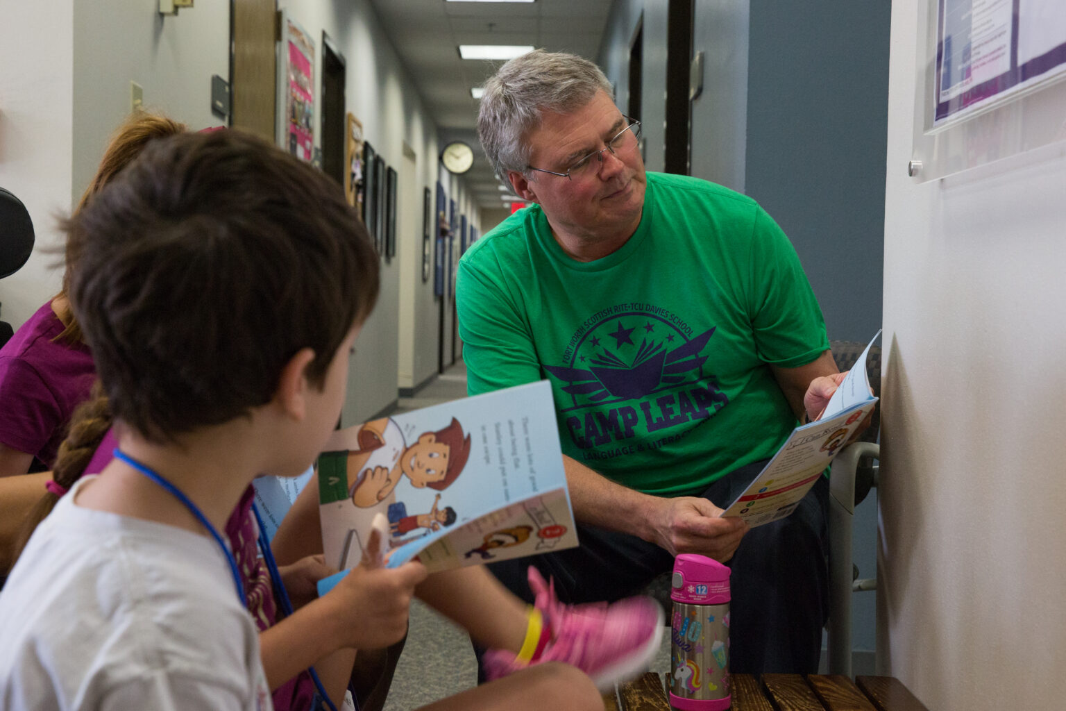 Camp Leaps Instructor reading with children