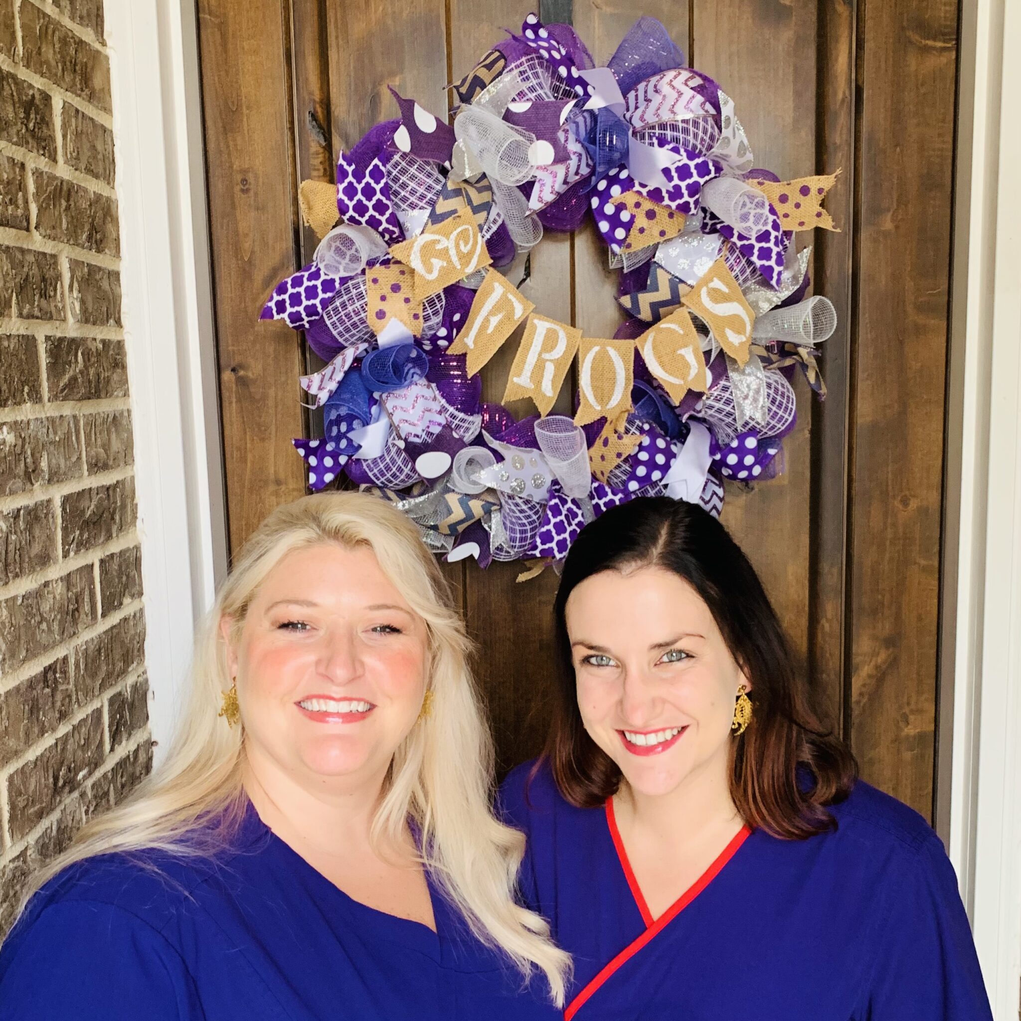 Diana and her friend wearing purple scrubs