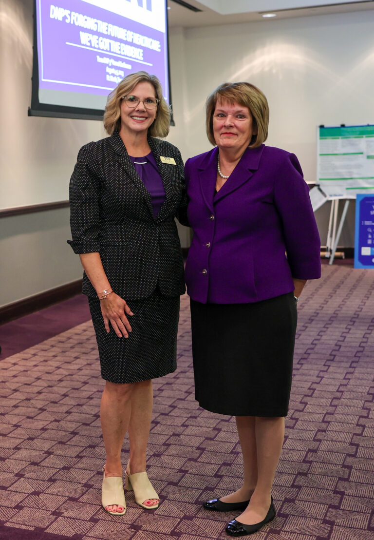  Representative Stephanie Klick posing with conference attendee