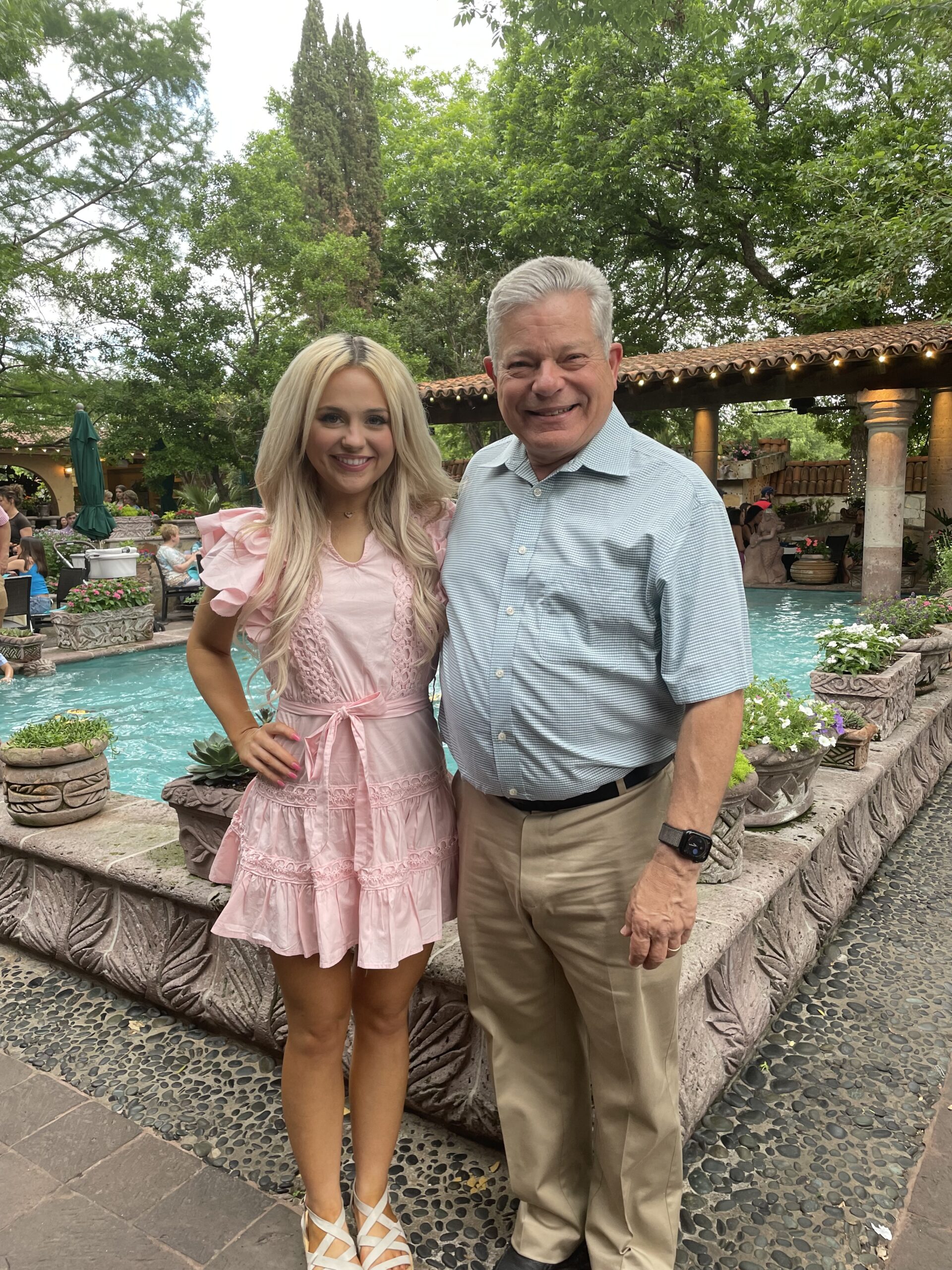 Dr. Earl Hampton pictured with TCU nursing alum Lizzie Fleming ’23 at her graduation celebration.