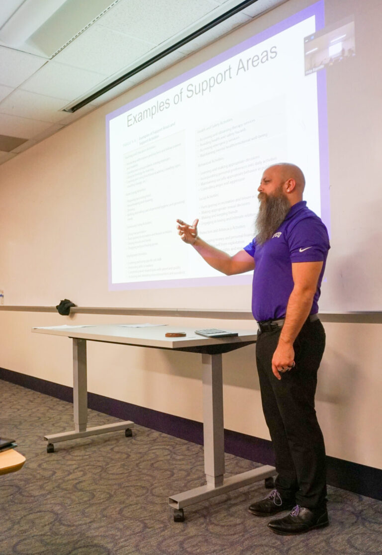 Dr. Esposito lecturing in a classroom