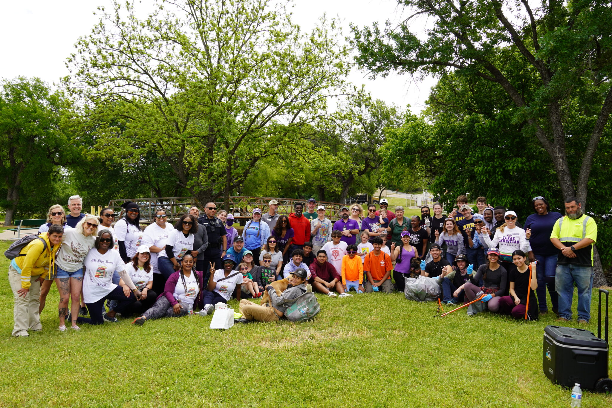 TCU students posing in Glenwood Park after picking up trash