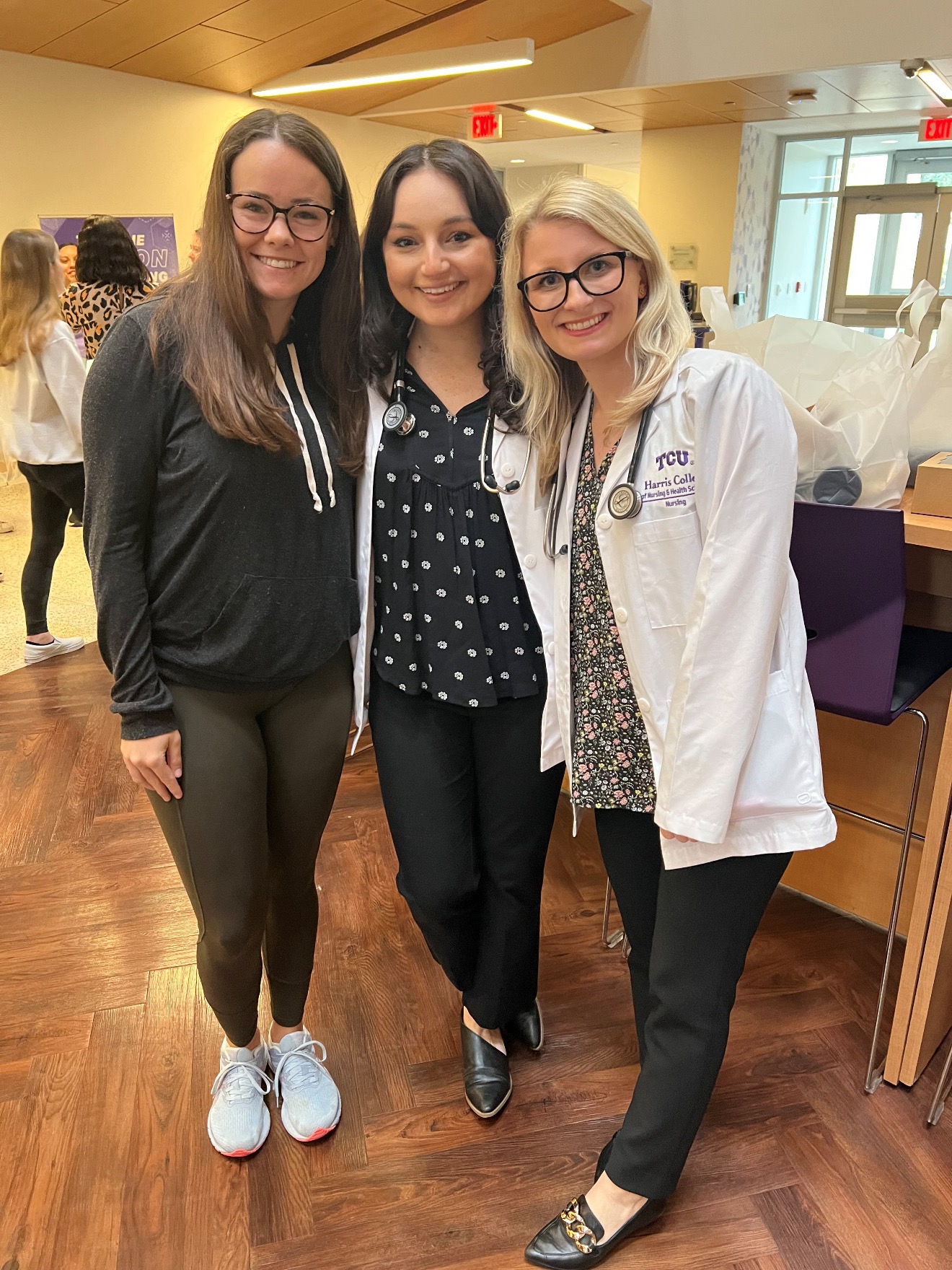 Katie Seliga posing with her classmates in TCU