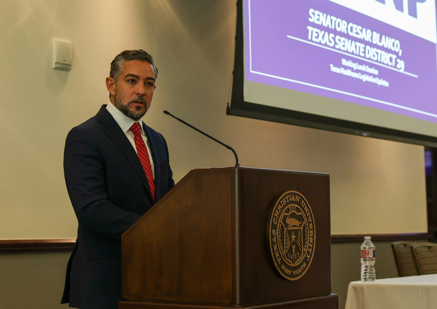 Senator Blanco speaking from the podium at the Texas Doctor of Nursing Practice Conference