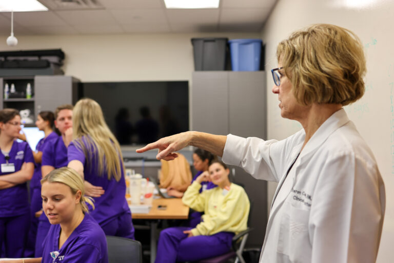 Assistant Professor of Professional Practice Sharon Canclini giving instructions to students